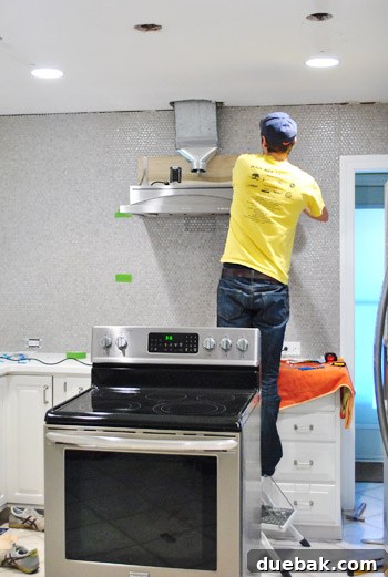 Second metal bracket being attached to the range hood