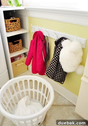 Streamline Your Laundry and Mudroom 6 Close-up of the white coat rack with various items, demonstrating its functionality.