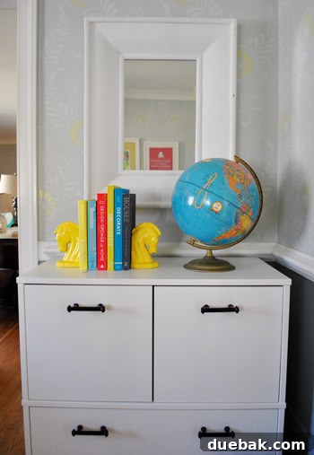 DIY Bookends: A Burst of Color 6 The newly painted bright yellow horse head bookends, now serving their purpose on a bookshelf, adding a pop of color.