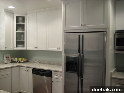 From Drab to Fab: Our Kitchen Renovation 4 Right side of new kitchen featuring stainless steel refrigerator, dishwasher, and ample counter space