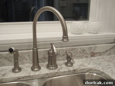 From Drab to Fab: Our Kitchen Renovation 8 Modern brushed nickel kitchen faucet and large undermount sink, a perfect blend of style and function