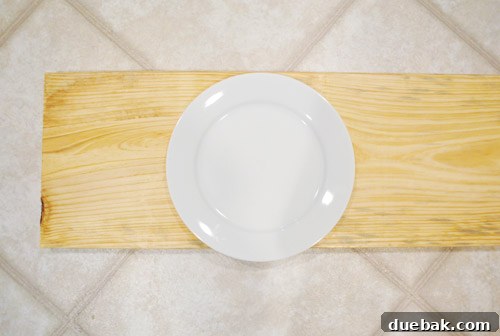 Dinner plates overhanging the edge of a raw wooden shelf, illustrating the width issue.