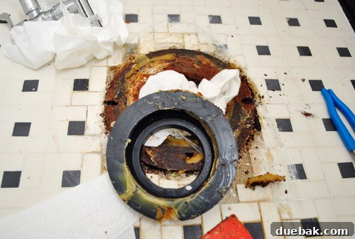 Rock-Solid Toilet: Easy DIY Fix 14 Removing old rubber reinforcement ring with wax ring under toilet
