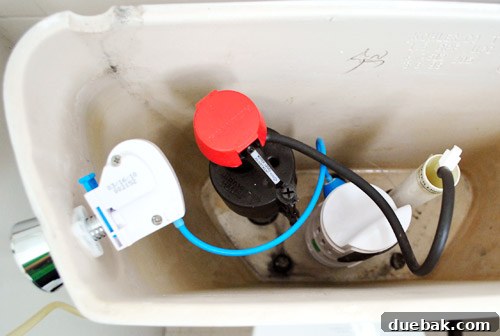 Rock-Solid Toilet: Easy DIY Fix 29 Dual flush toilet retrofit kit shown inside open toilet tank