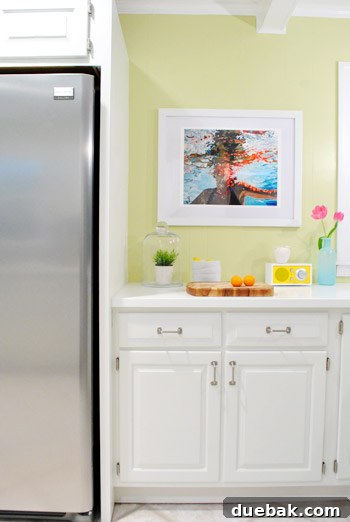 A detailed shot highlighting the 'floating' effect of the art print within its DIY frame. The print is gently elevated against the mat board, showcasing the subtle gray undertones of the mat that beautifully complement the bright white of the artwork.