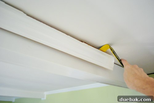 Detailed shot of existing crown molding on a kitchen beam