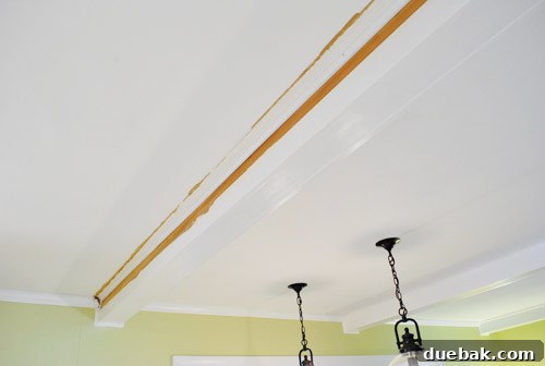 Prepping crown molding for final paint application, including nail hole filling