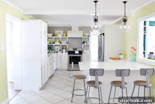Wide view of the kitchen after crown molding installation, looking much more finished