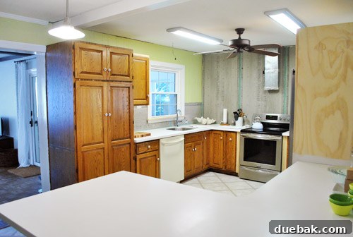 Before renovation image showing an off-centered kitchen window