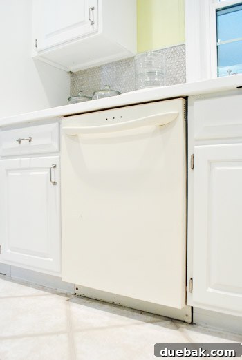 Old bisque dishwasher in kitchen