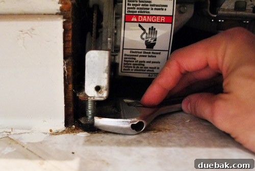 Adjusting dishwasher feet