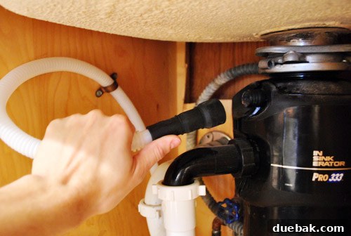 Connecting new drain hose to garbage disposal
