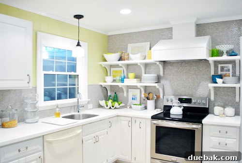 Pendant Light Makeover: Spray Painting Your Cord and Canopy 13 The newly installed light fixture illuminated in the kitchen