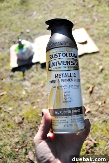 Pendant Light Makeover: Spray Painting Your Cord and Canopy 4 The light fixture being prepared for spray painting