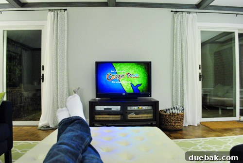 Elevate Your Entertainment 9 View of the new television from the couch, displaying an episode of Cougar Town with clear subtitles