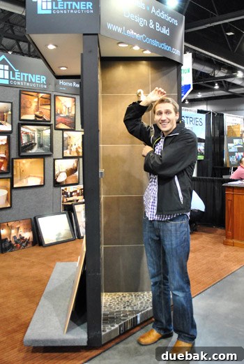Final humorous photo of a Petersik posing in a display shower at the Home & Garden Show