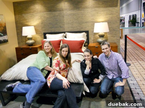 Humorous 'Keep Portland Weird' pose by the author and Sherry next to a bed display at the meet and greet
