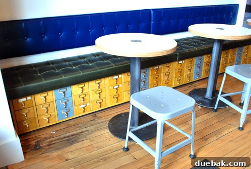 Library-card-catalogs repurposed into bench seating at Schoolhouse Electric