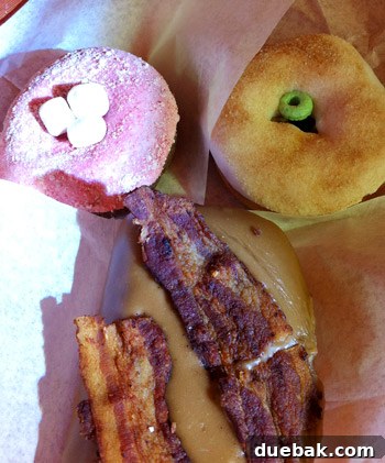 Assortment of Voodoo Doughnuts, including Bacon Maple Bar and Neapolitan