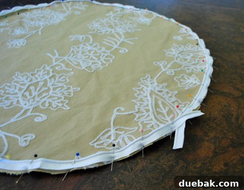 Piping pinned to fabric circle