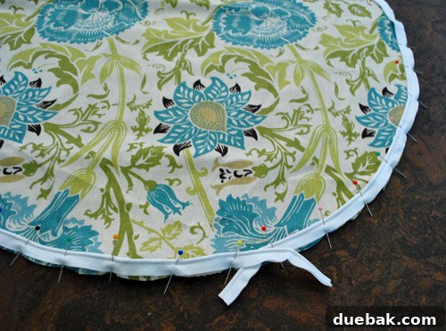 Second fabric circle with piping pinned