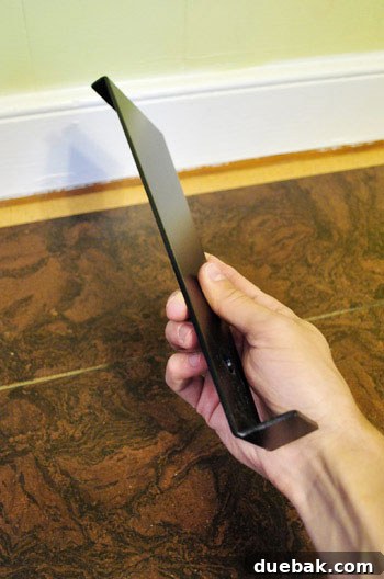 Using a pull bar for cork flooring installation
