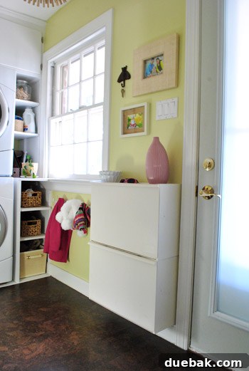 Laundry room after cork flooring, featuring a subtle decorative basket and enhanced coziness.