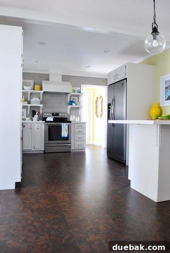 Remodeled kitchen with new cork flooring, showcasing a welcoming and personalized atmosphere.
