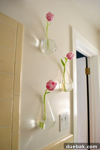 Sculptural Wall Vases 5 View of the guest bathroom wall with floating vases, hinting at future renovation plans.
