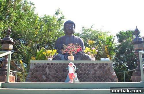 The impressive Great Buddha statue at the Lahaina Jodo Mission, standing tall against the Hawaiian sky.