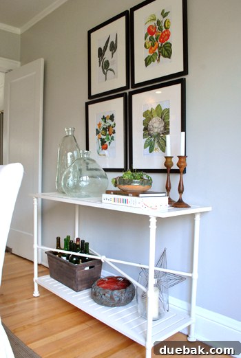Sweetly accessorized console table positioned behind the dining area, showcasing Kirsten's decorative flair