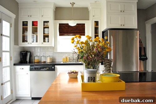 Kitchen walls painted in Benjamin Moore Rockport Gray, beautifully complementing the cabinets and enhancing the room's luxurious feel