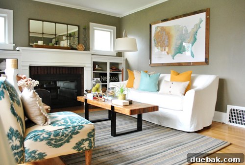 Cozy living room featuring a large world map as a focal point, complemented by sophisticated Benjamin Moore Copley Gray walls