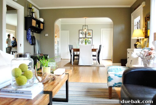 Elegant dining area entrance with a cool, slightly arched doorway, signifying a refined transition from the living room