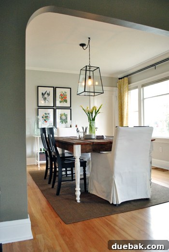 Stunning dining room chandelier from Ballard Design, acting as a stylish focal point above the dining table