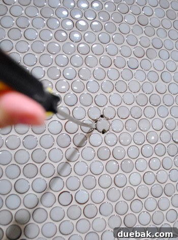 Flawless Penny Tile Repair 6 Chiseling out old tiles for repair