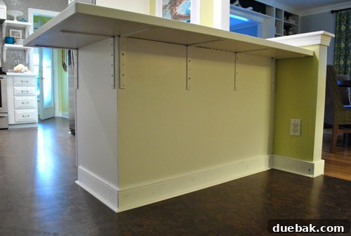 Finished peninsula with shoe molding, awaiting caulk and paint