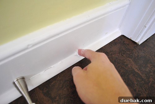 Smoothing caulk with a wet finger