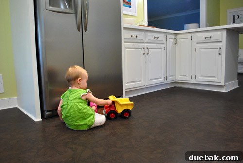 Clara playing on newly sealed cork kitchen floor