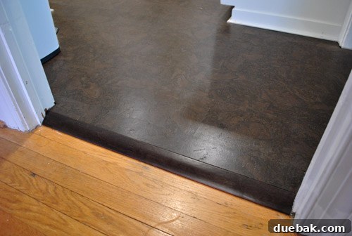 Newly installed floor transition (reducer) in kitchen doorway