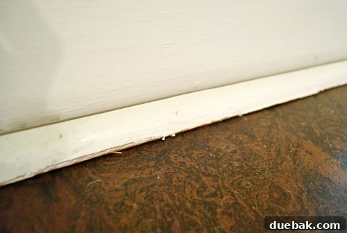 Old shoe molding looking worn and imperfect