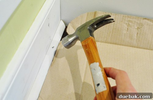 Cardboard protecting floor during shoe molding installation