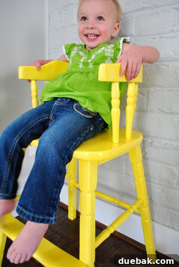 Giving an Old Wooden Highchair a Makeover 12 toddler smiling in new highchair