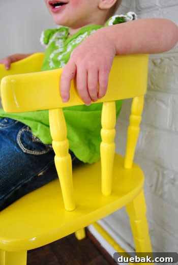 Giving an Old Wooden Highchair a Makeover 15 detail shot of glossy yellow highchair finish