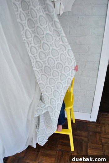 Giving an Old Wooden Highchair a Makeover 18 toddler playing hide and seek in highchair