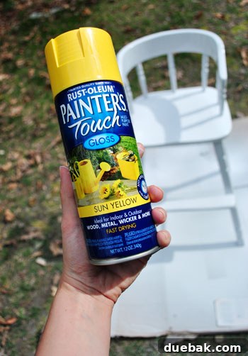 Giving an Old Wooden Highchair a Makeover 7 highchair during yellow spray paint application