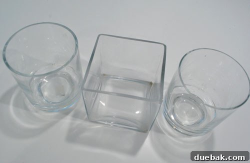 A collection of empty glass vases of various shapes and sizes, perfect for repurposing.