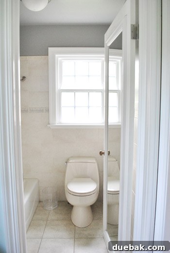Master bathroom painted in Benjamin Moore Rockport Gray, before shower curtain rehung.