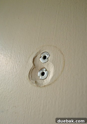 Method of hammering in metal anchors for repair.