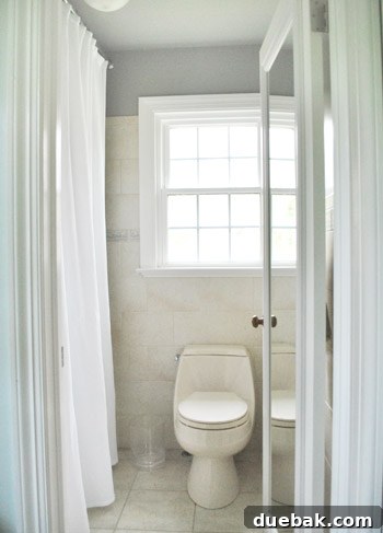 Master bathroom with Rockport Gray walls and shower curtain rehung.